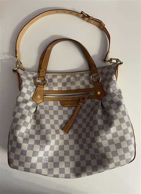 geanta louis vuitton originala .